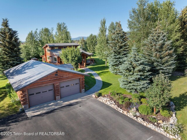 5100 Country Club Dr, Victor, ID 83455 - view of front of property with a front lawn and a metal roof