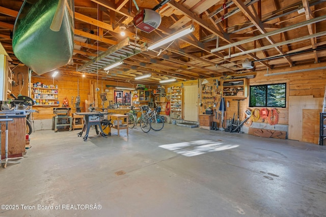 5100 Country Club Dr, Victor, ID 83455 - garage with a workshop area and a garage door opener