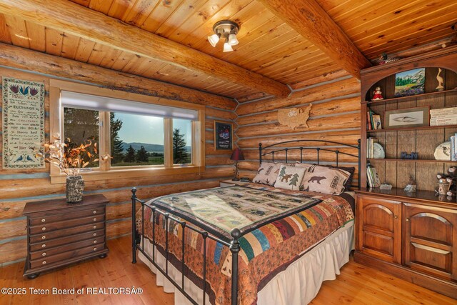 5100 Country Club Dr, Victor, ID 83455 - bedroom with rustic walls, light wood-style flooring, and a wooden ceiling with exposed beams