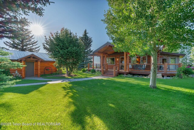 5100 Country Club Dr, Victor, ID 83455 - view of green lawn featuring covered porch