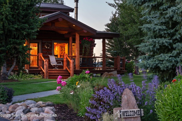 5100 Country Club Dr, Victor, ID 83455 - view of front facade featuring a porch and a metal roof