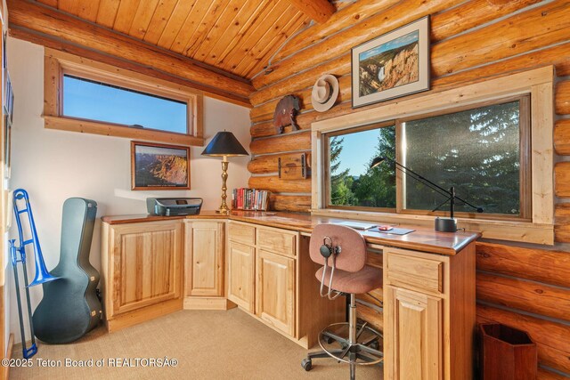 5100 Country Club Dr, Victor, ID 83455 - office area featuring log walls, wooden ceiling, built in desk, and light colored carpet
