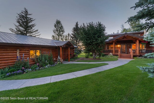 5100 Country Club Dr, Victor, ID 83455 - view of grassy yard featuring covered porch