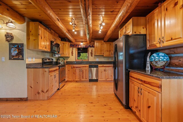 5100 Country Club Dr, Victor, ID 83455 - kitchen featuring stainless steel appliances, a wood ceiling with exposed beams, light wood-style flooring, a textured wall, and dark stone counters