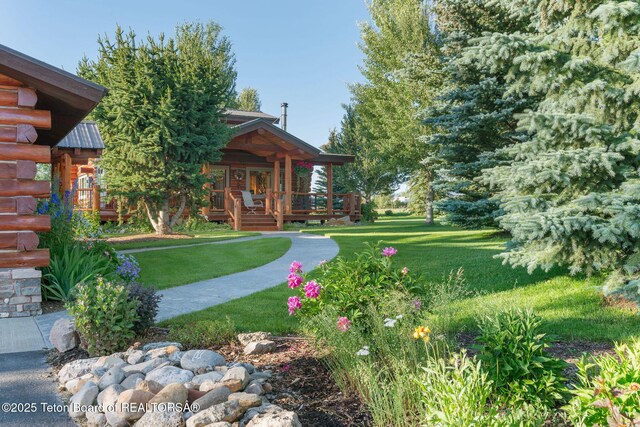 5100 Country Club Dr, Victor, ID 83455 - view of grassy yard featuring covered porch
