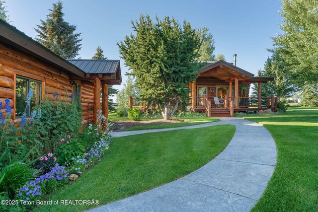 5100 Country Club Dr, Victor, ID 83455 - view of green lawn featuring a wooden deck