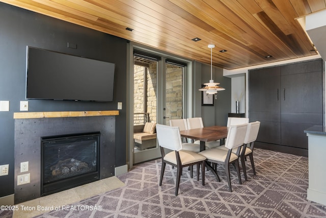 3325 W Village Dr Unit 359/361, Teton Village, WY 83025 - dining space with wooden ceiling and a glass covered fireplace