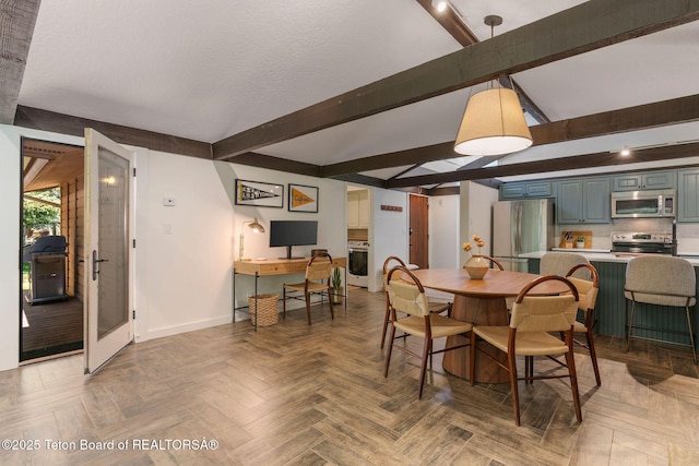550 E Golf Creek Ln Unit 41, Jackson, WY 83001 - dining area with beam ceiling and baseboards