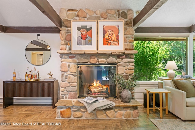 550 E Golf Creek Ln Unit 41, Jackson, WY 83001 - living area with a stone fireplace and a textured ceiling