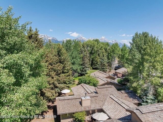 550 E Golf Creek Ln Unit 41, Jackson, WY 83001 - view from above of property with mountains and a heavily wooded area