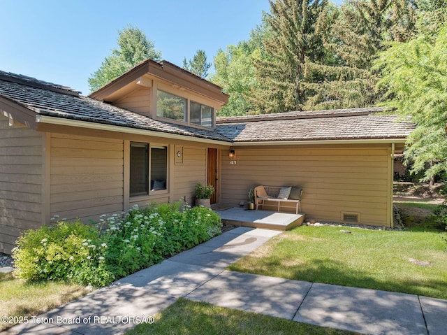 550 E Golf Creek Ln Unit 41, Jackson, WY 83001 - view of front facade featuring a front yard