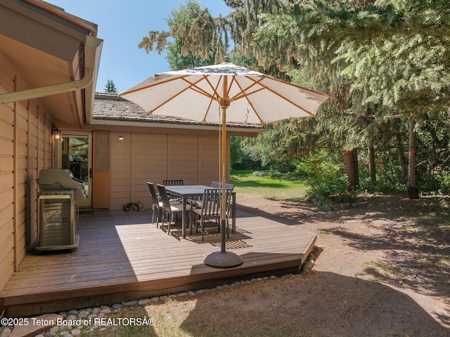 550 E Golf Creek Ln Unit 41, Jackson, WY 83001 - wooden deck with outdoor dining area and grilling area