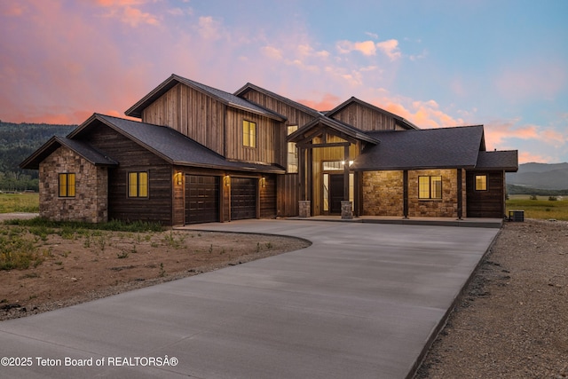 555 Silver Fox Ln, Victor, ID 83455 - view of front of home with driveway and stone siding