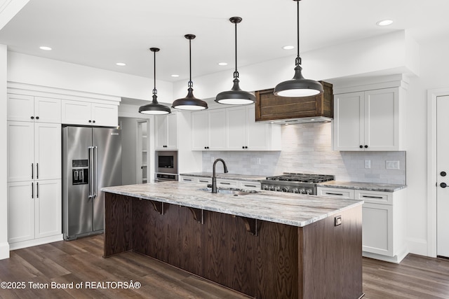555 Silver Fox Ln, Victor, ID 83455 - kitchen featuring high quality fridge, stove, dark wood finished floors, white cabinets, and recessed lighting