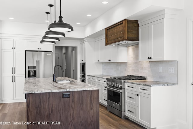 555 Silver Fox Ln, Victor, ID 83455 - kitchen with high quality appliances, white cabinets, dark wood-style flooring, light stone countertops, and tasteful backsplash