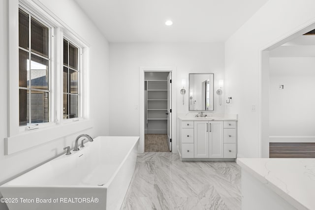 555 Silver Fox Ln, Victor, ID 83455 - full bath with a freestanding tub, vanity, and recessed lighting