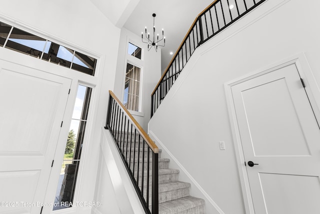 555 Silver Fox Ln, Victor, ID 83455 - foyer entrance with a towering ceiling, a chandelier, and stairs