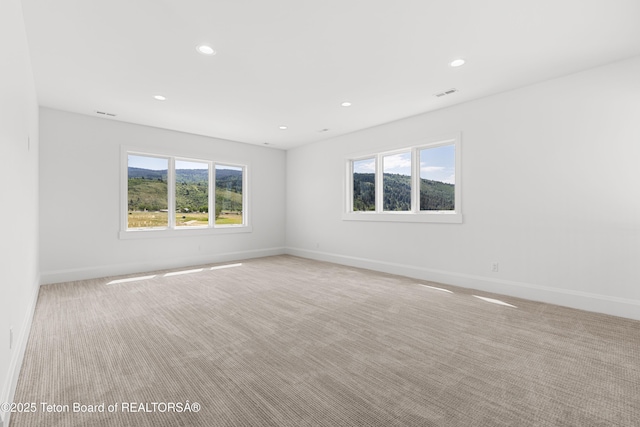 555 Silver Fox Ln, Victor, ID 83455 - unfurnished room featuring light colored carpet and recessed lighting