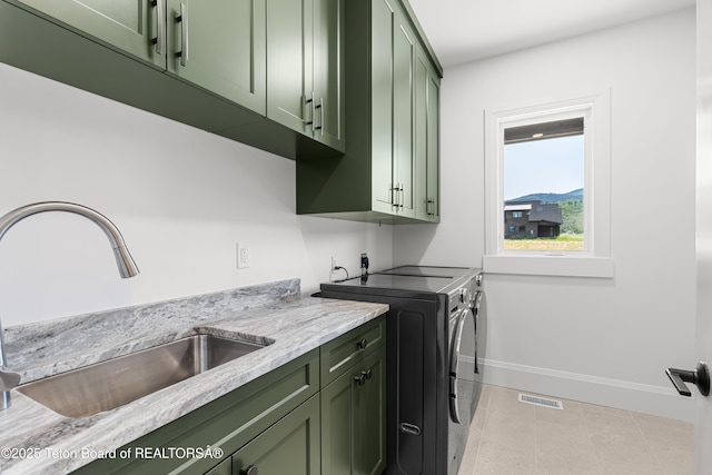 555 Silver Fox Ln, Victor, ID 83455 - washroom with cabinet space and independent washer and dryer