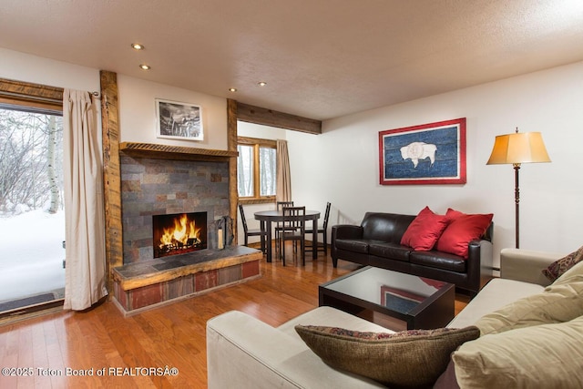 3885 S Lake Creek Dr Unit 1013, Wilson, WY 83014 - living room featuring a fireplace, wood finished floors, and recessed lighting