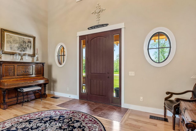 6289 Fox Meadows Dr, Victor, ID 83455 - foyer entrance with wood finished floors and a towering ceiling