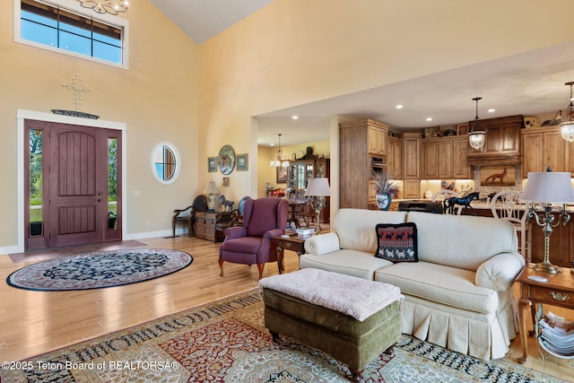 6289 Fox Meadows Dr, Victor, ID 83455 - living area with a chandelier, light wood-type flooring, plenty of natural light, and high vaulted ceiling
