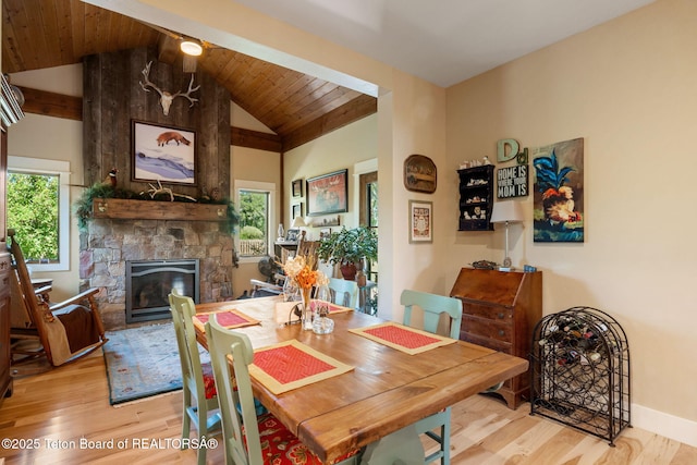 6289 Fox Meadows Dr, Victor, ID 83455 - dining room with wood finished floors, a stone fireplace, vaulted ceiling, and wooden ceiling