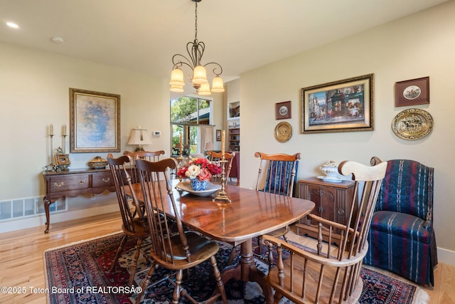 6289 Fox Meadows Dr, Victor, ID 83455 - dining area featuring wood finished floors, a chandelier, and recessed lighting