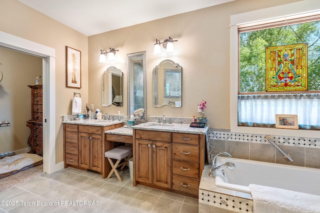 6289 Fox Meadows Dr, Victor, ID 83455 - full bath featuring two vanities, a garden tub, and tile patterned flooring