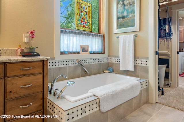 6289 Fox Meadows Dr, Victor, ID 83455 - full bathroom featuring a bath, vanity, and tile patterned floors