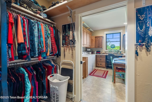 6289 Fox Meadows Dr, Victor, ID 83455 - spacious closet featuring washing machine and dryer and light tile patterned flooring