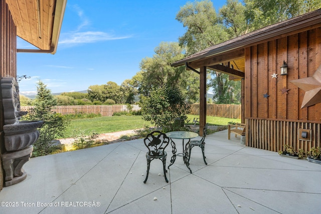6289 Fox Meadows Dr, Victor, ID 83455 - fenced backyard with a patio area