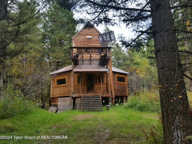 141 W 12250 N, Tetonia, ID 83452 - rear view of house featuring a wooded view and a metal roof