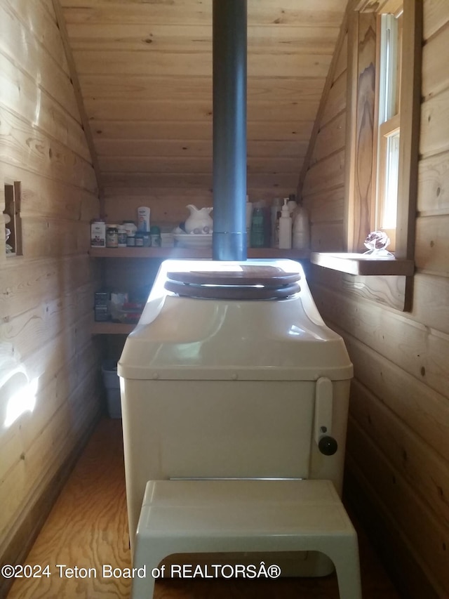 141 W 12250 N, Tetonia, ID 83452 - washroom featuring wooden ceiling, wooden walls, washer / clothes dryer, and wood finished floors