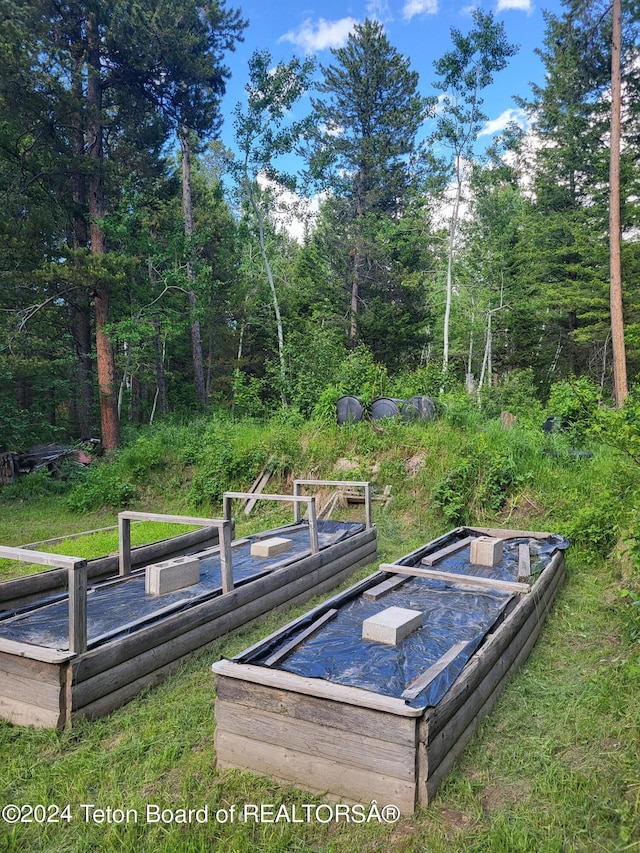 141 W 12250 N, Tetonia, ID 83452 - wooden terrace with a wooded view