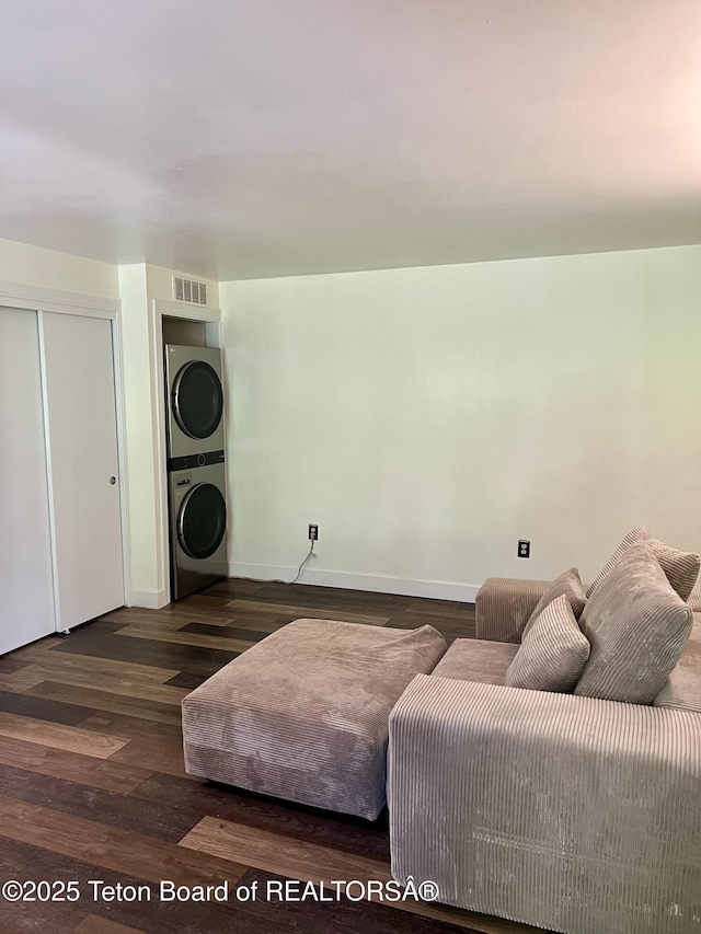 220 Homestead Rd Unit 203, Victor, ID 83455 - living area featuring stacked washing machine and dryer and wood finished floors