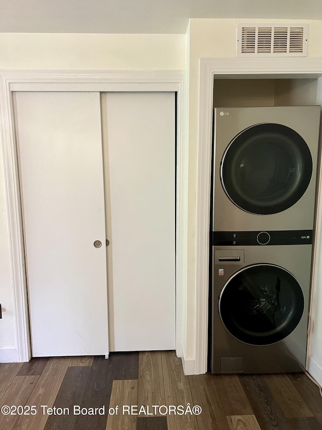 220 Homestead Rd Unit 203, Victor, ID 83455 - laundry area with stacked washing machine and dryer and dark wood-style flooring