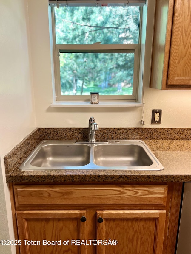 220 Homestead Rd Unit 203, Victor, ID 83455 - kitchen view of brown cabinetry and dark countertops