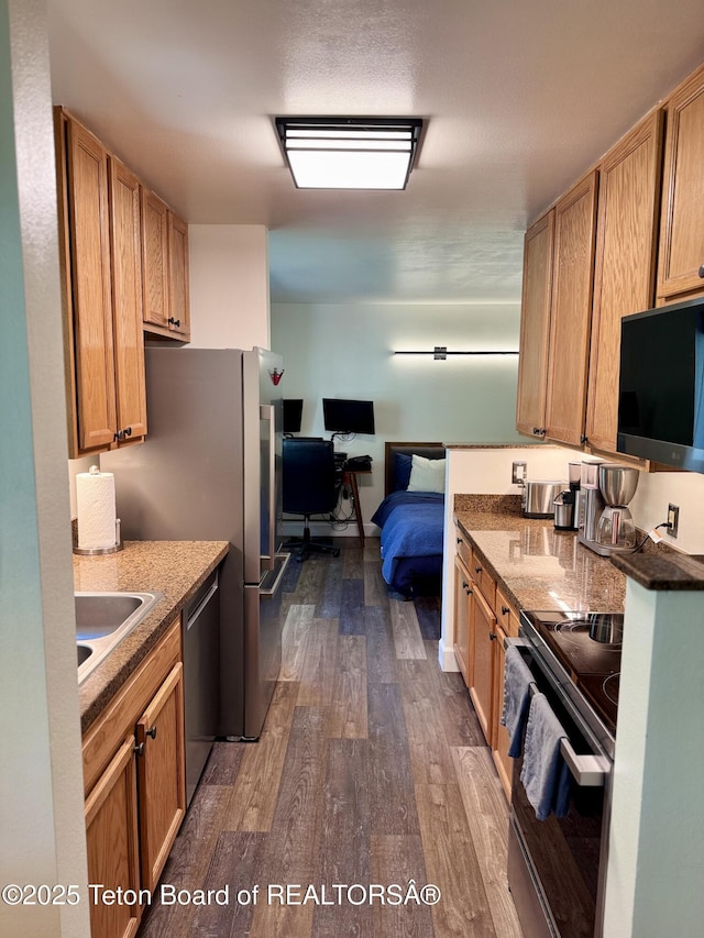 220 Homestead Rd Unit 203, Victor, ID 83455 - kitchen featuring appliances with stainless steel finishes and dark wood-style floors