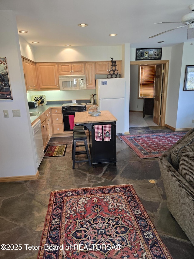 750 N Bar Y Rd, Jackson, WY 83001 - kitchen featuring white appliances, light brown cabinets, light countertops, a ceiling fan, and recessed lighting