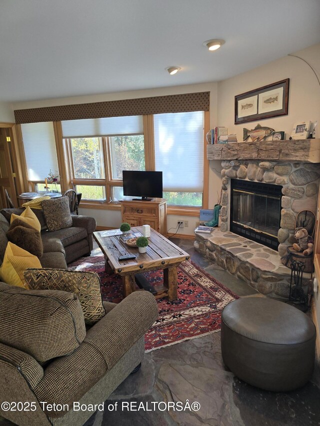 750 N Bar Y Rd, Jackson, WY 83001 - living area featuring healthy amount of natural light and a fireplace