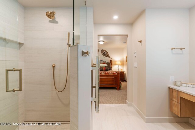 750 N Bar Y Rd, Jackson, WY 83001 - ensuite bathroom with tiled shower, vanity, and recessed lighting