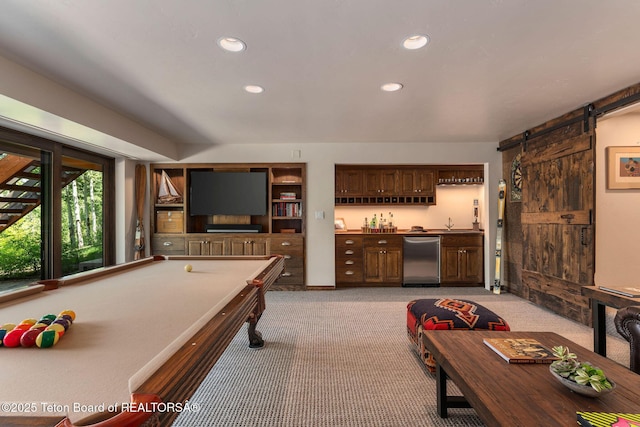 750 N Bar Y Rd, Jackson, WY 83001 - recreation room featuring light colored carpet, wet bar, recessed lighting, and a barn door