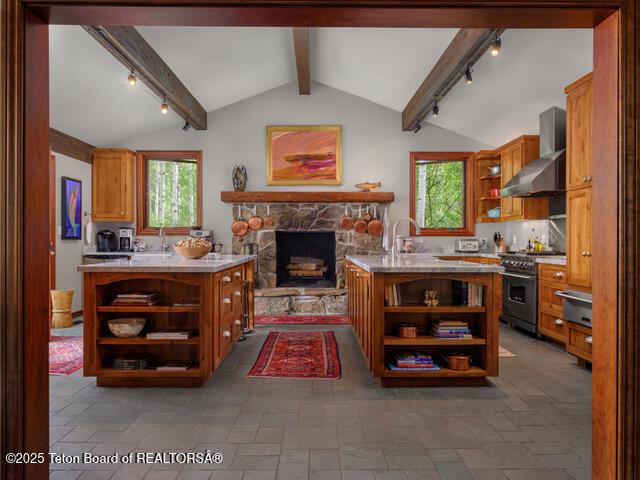 750 N Bar Y Rd, Jackson, WY 83001 - kitchen with open shelves, high end stove, and track lighting