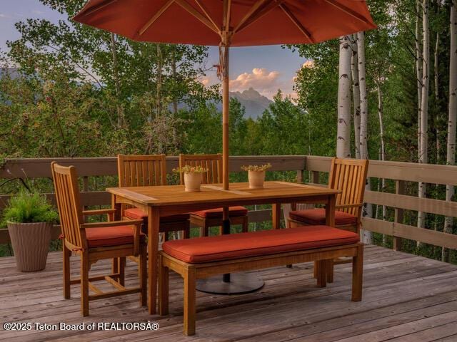 750 N Bar Y Rd, Jackson, WY 83001 - deck at dusk with outdoor dining space