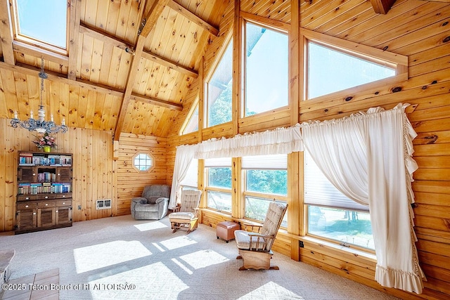386 Dogwood Dr, Star Valley Ranch, WY 83127 - living area with high vaulted ceiling, carpet floors, a wooden ceiling with exposed beams, and wood walls