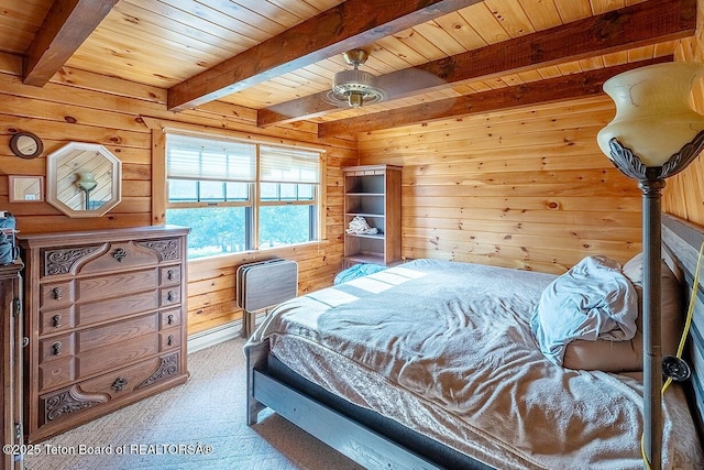 386 Dogwood Dr, Star Valley Ranch, WY 83127 - bedroom featuring carpet, wood walls, and a wood ceiling with exposed beams