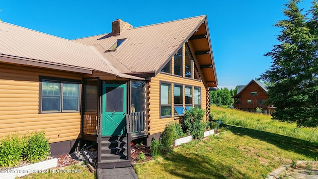386 Dogwood Dr, Star Valley Ranch, WY 83127 - log home with entry steps, log exterior, a front yard, a chimney, and a metal roof