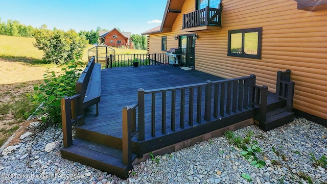 386 Dogwood Dr, Star Valley Ranch, WY 83127 - wooden terrace with a grill and an outbuilding