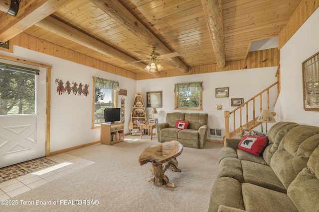 3320 Griffel Ct, Island Park, ID 83429 - tiled living area with a wooden ceiling with exposed beams, stairway, ceiling fan, and carpet floors